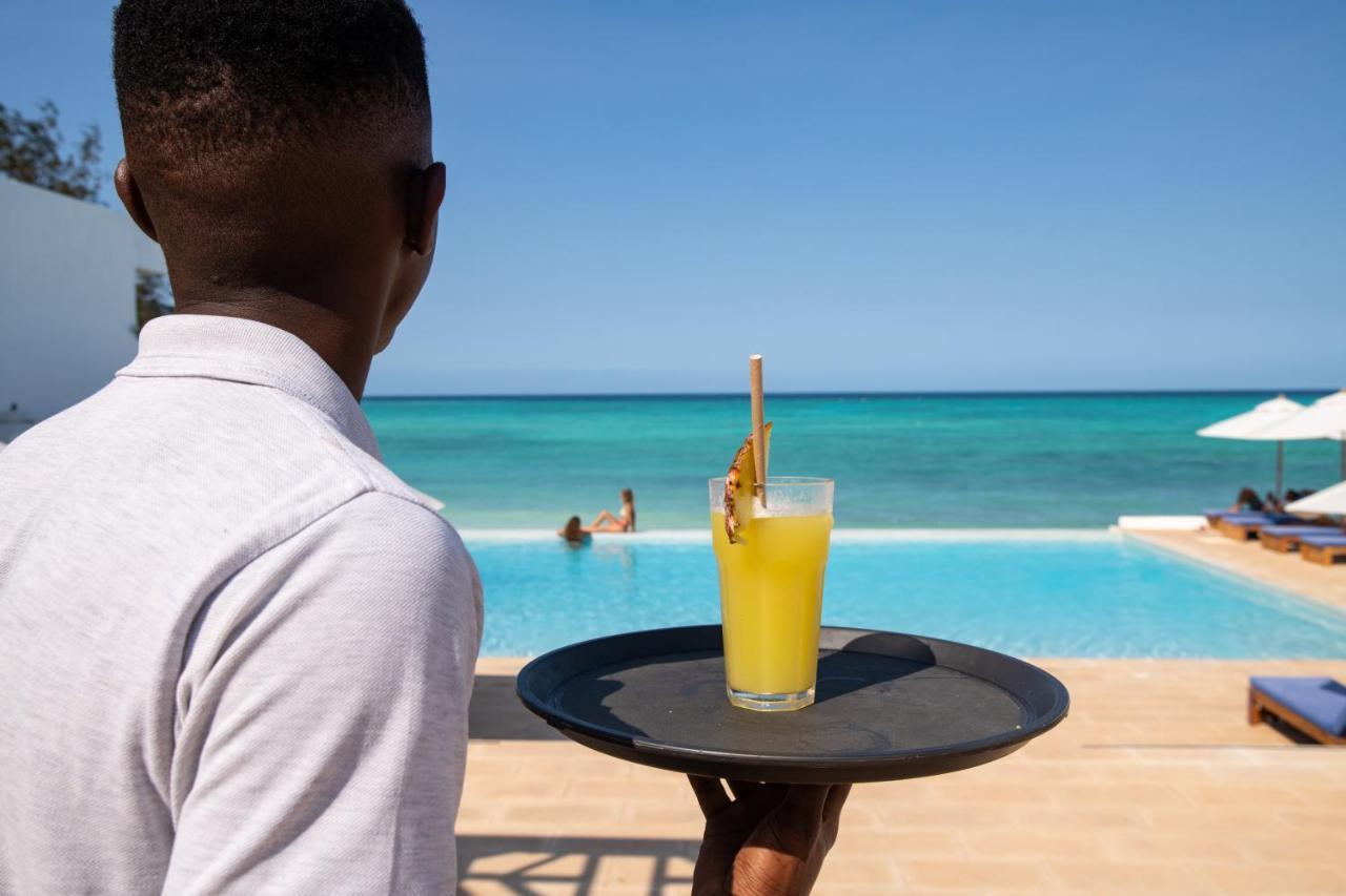 Nungwi Dreams By Mantis Hotel Exterior photo A waiter at the pool