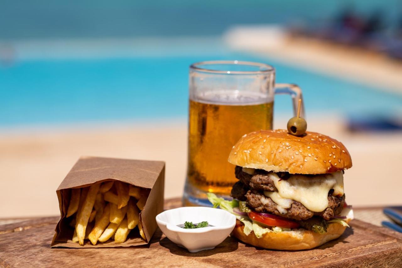 Nungwi Dreams By Mantis Hotel Exterior photo A cheeseburger with chips and a beer