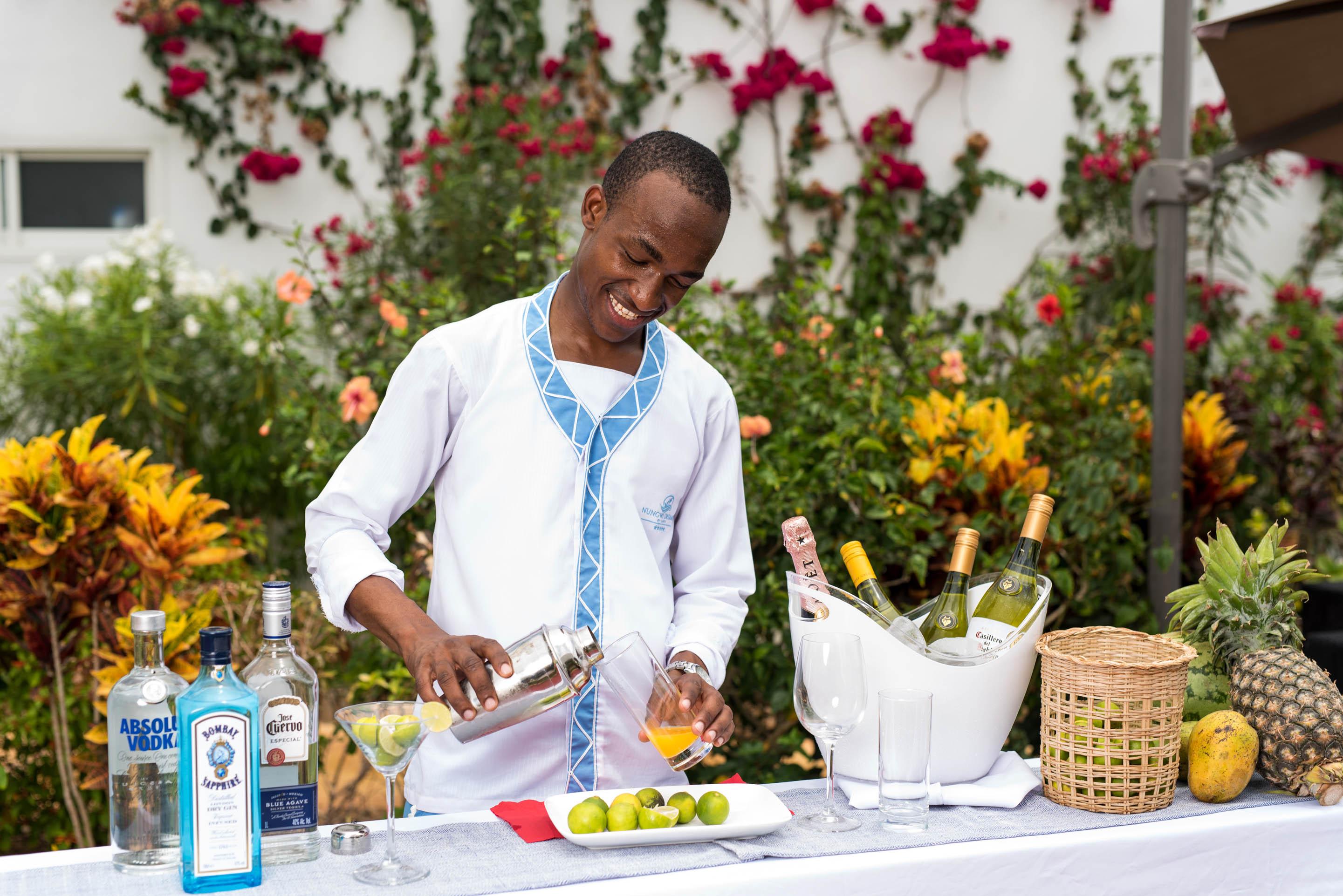 Nungwi Dreams By Mantis Hotel Exterior photo A bartender preparing a cocktail
